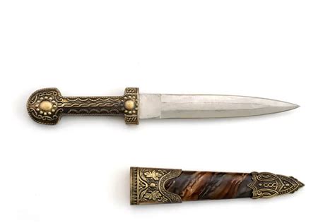The intricate designs and sigils on magical daggers